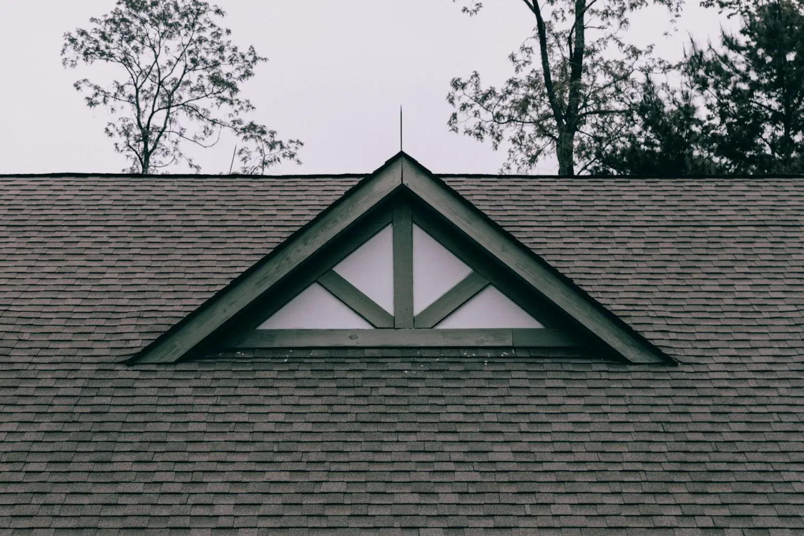 Arizona sky above a shingled residential roof